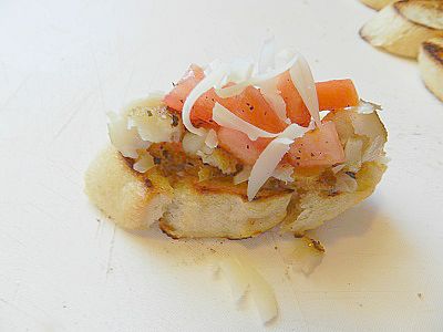 Step-by-step tutorial with pictures on how to make Toasted Baguette Topped with Tomatoes, Garlic, and Cheese